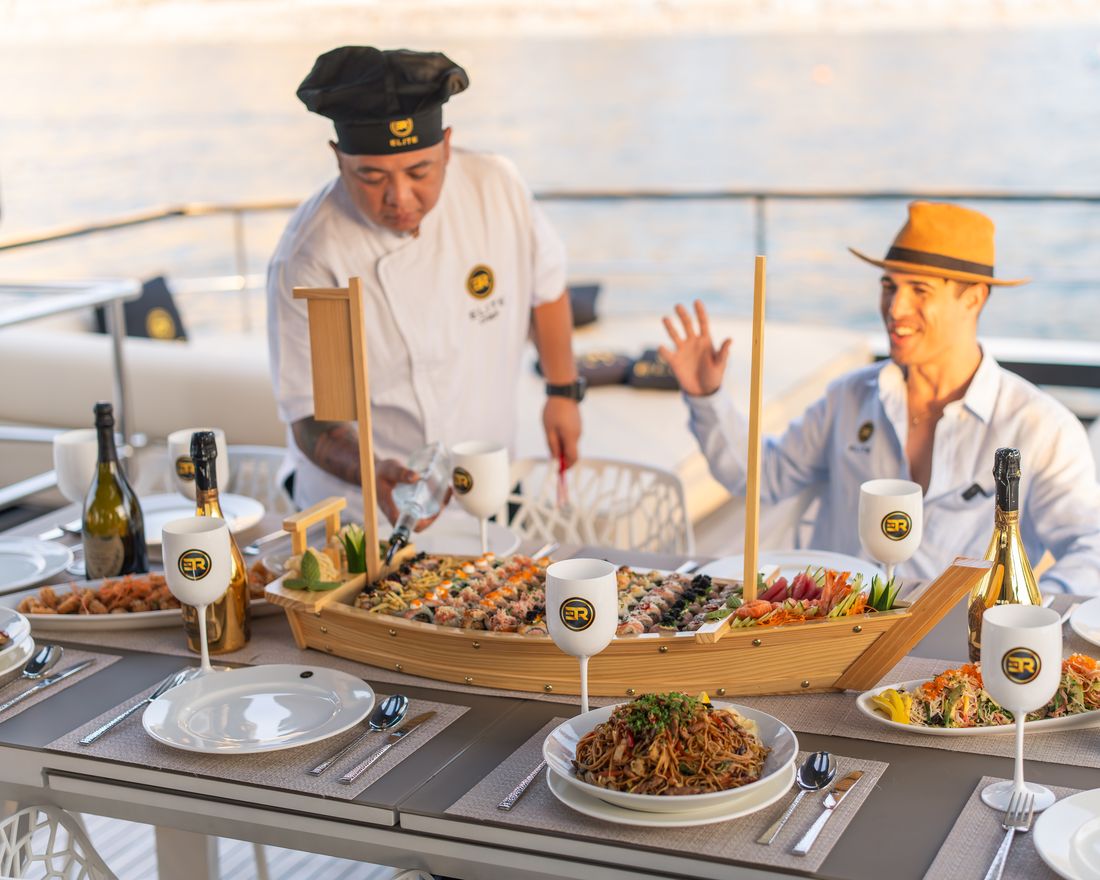 Private chef serving a sushi boat on deck
